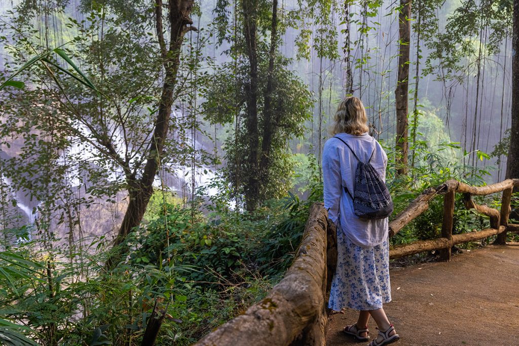 Pha Suea Waterfall offers a free entrance, making it an easy and budget-friendly stop along your Mae Hong Son journey. There’s parking available for both cars and motorbikes, and you’ll find clean public toilets near the entrance. While the area is generally quiet and low-key, a few simple stalls may occasionally be open selling drinks or local snacks—but it’s a good idea to bring your own just in case. A short paved trail leads you through the forest to the waterfall, complete with stone steps, scenic viewpoints, and shaded benches for relaxing along the way.